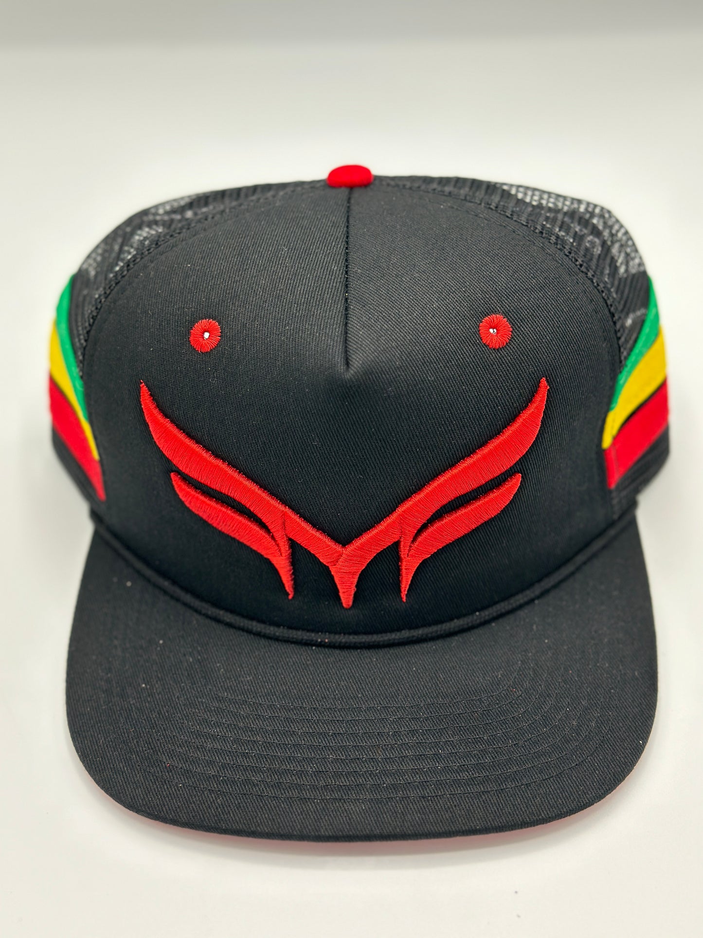 THE “RASTA“ TRUCKER MESH W/ RED 3D PUFF LOGO